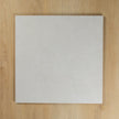 Boston Bianco Matte square tile on a wooden surface