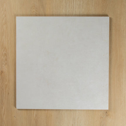 Boston Bianco Matte square tile on a wooden surface