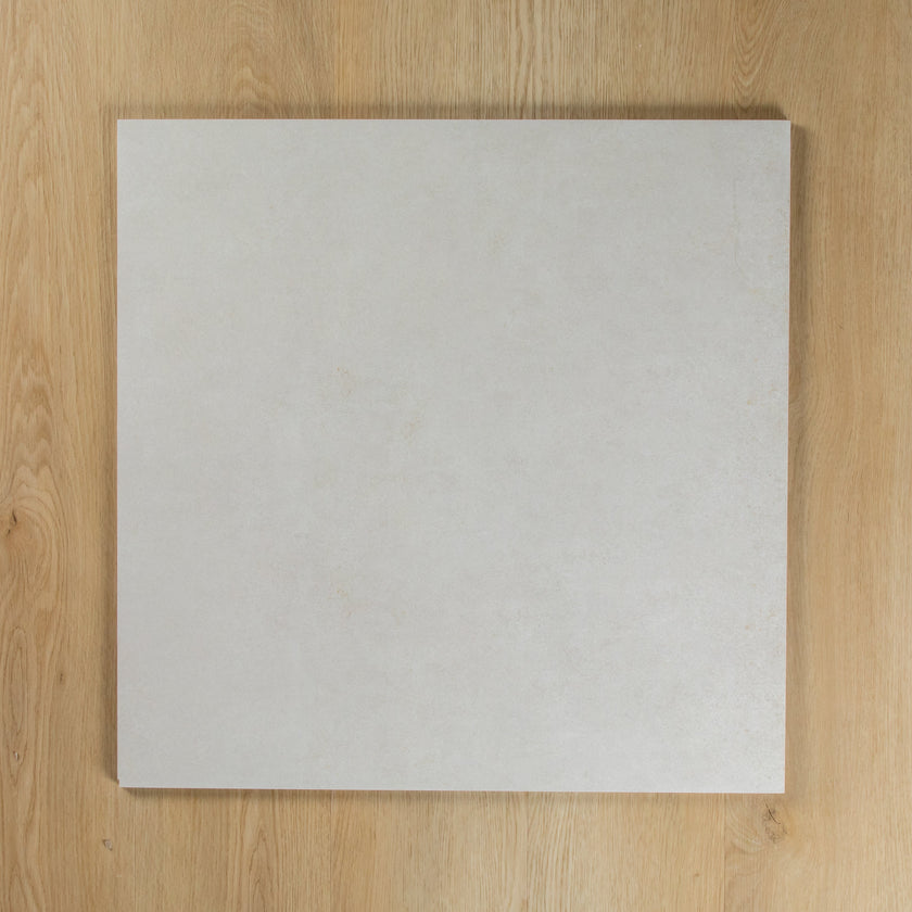 Boston Bianco Matte square tile on a wooden surface